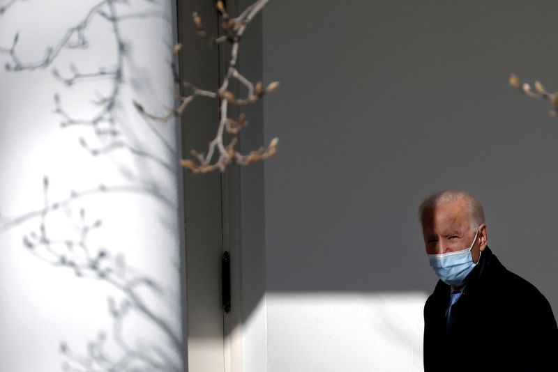 FILE PHOTO: U.S. President Biden walks into Oval Office in