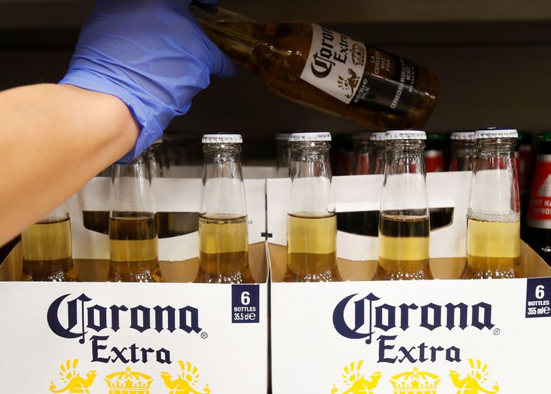 Bottles of Corona Extra beer are displayed for sale in