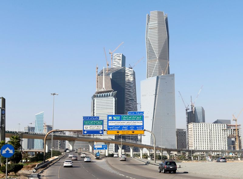 FILE PHOTO: Cars drive past the King Abdullah Financial District