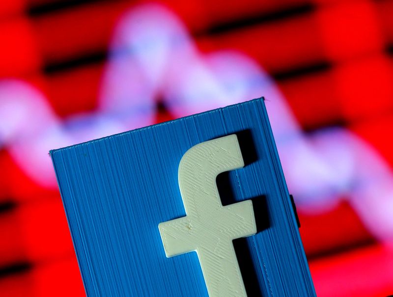 FILE PHOTO: Illustration shows a 3D-printed Facebook logo in front