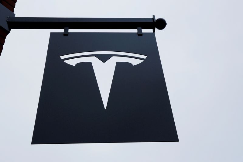 FILE PHOTO: A Tesla logo hang on a building outside