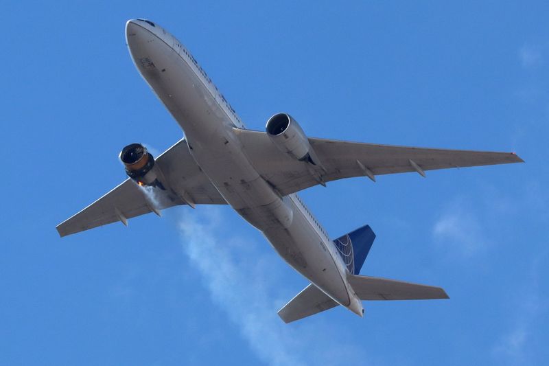 FILE PHOTO:  United Airlines flight UA328 returns to Denver