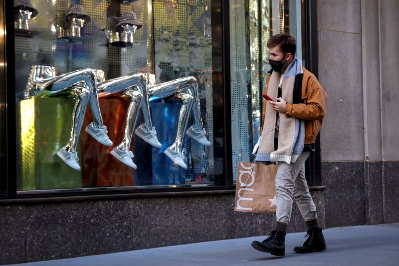 FILE PHOTO: A man shops on 5th Avenue in New