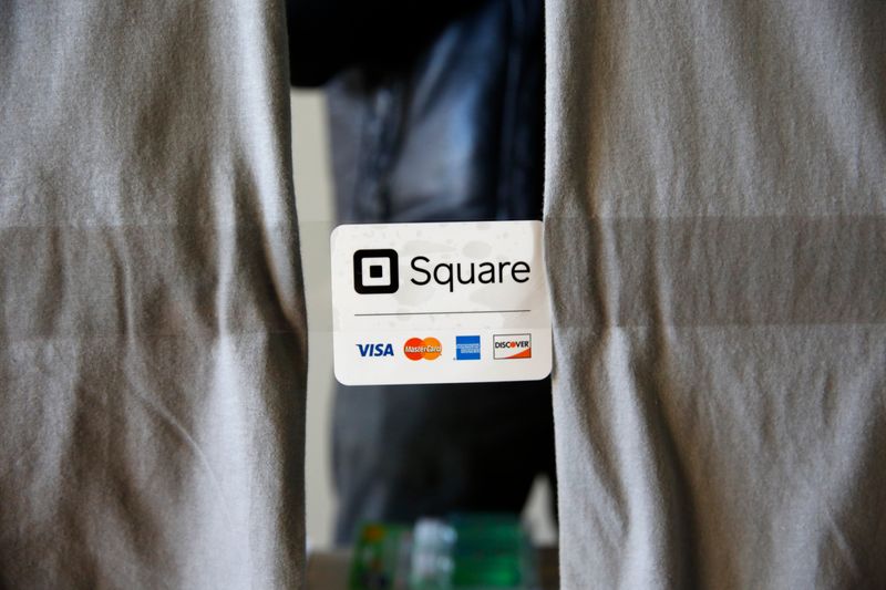 An advertisement for the Square payment processor is seen outside