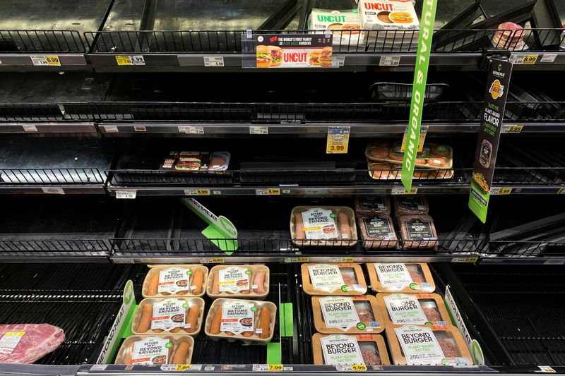 Beyond Meat products are displayed on grocery store shelves inside