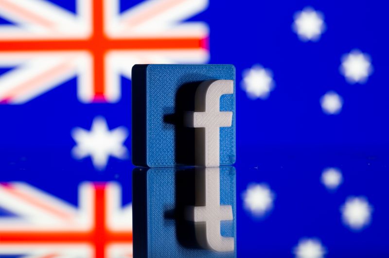 FILE PHOTO: A 3D-printed Facebook logo is seen in front