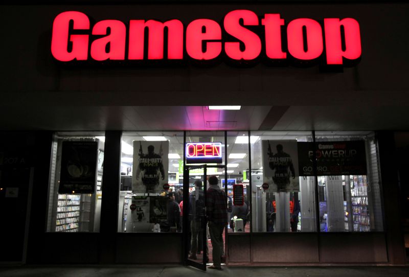 FILE PHOTO: People enter a GameStop store during “Black Friday”