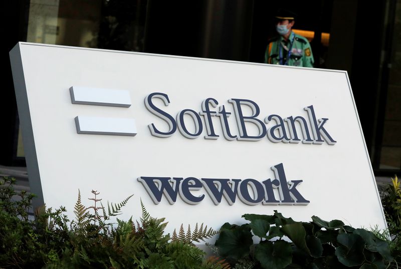 The logos of SoftBank and WeWork are displayed in front