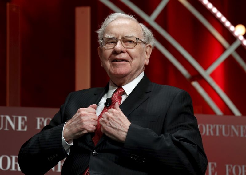 Buffett, chairman and CEO of Berkshire Hathaway, takes his seat