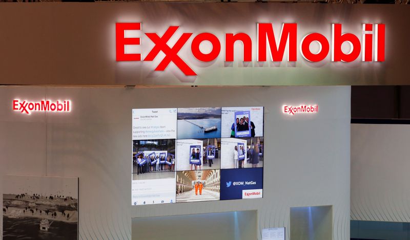 Logos of ExxonMobil are seen in its booth at Gastech,