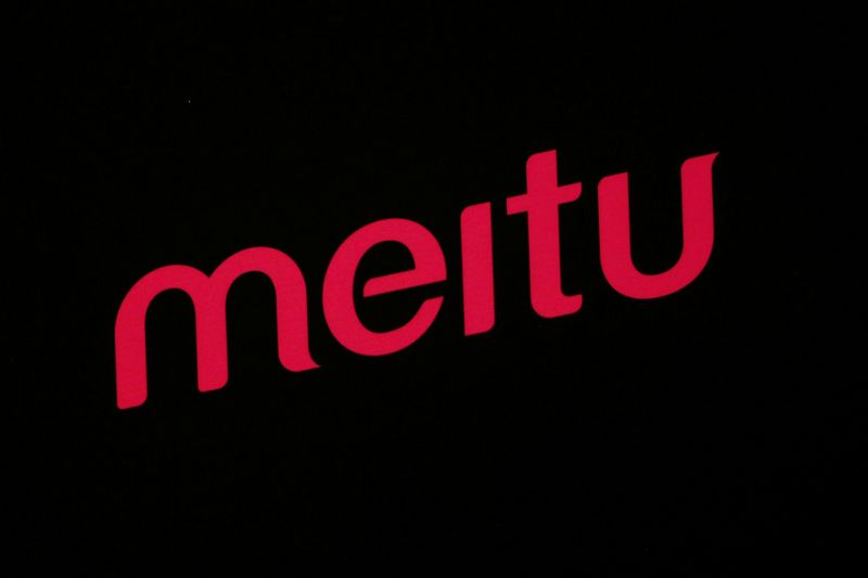 A logo of Meitu is displayed at a news conference