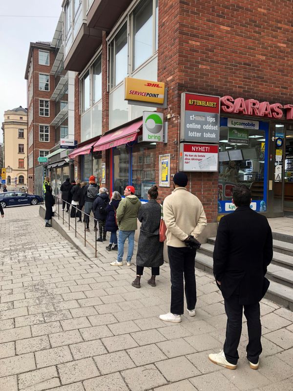 Swedes queue to buy alcohol before the state-run alcohol monopoly