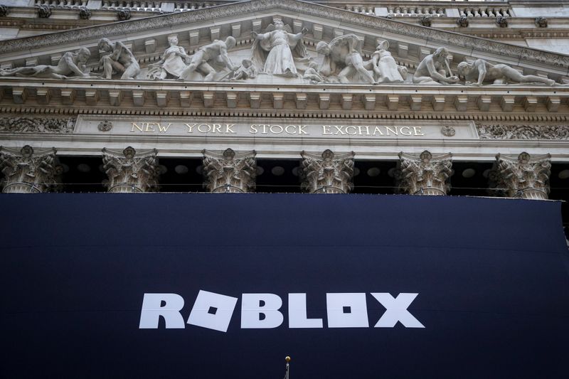 The Roblox logo is displayed on a banner, to celebrate