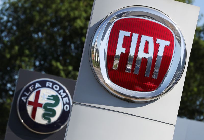 Logos of Fiat and Alfa Romeo are seen outside a