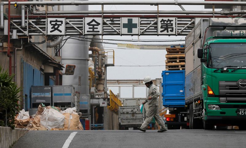 A worker walks at a factory in Tokyo
