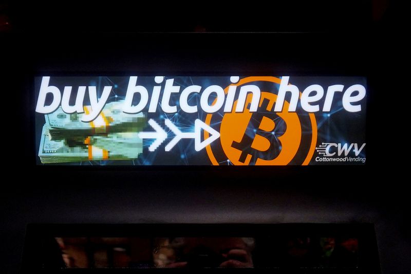 FILE PHOTO: A Bitcoin ATM sign is pictured in a