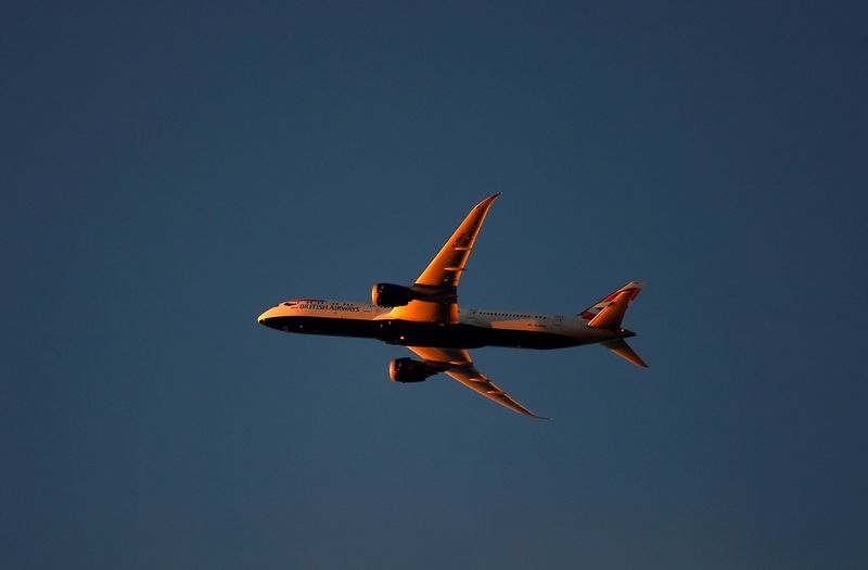 FILE PHOTO: A British Airways aircraft flies over London