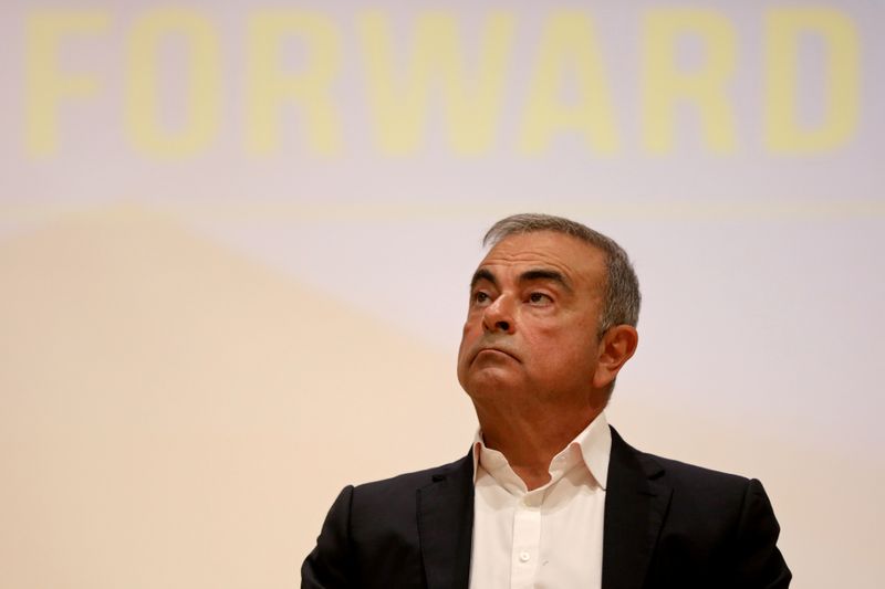 FILE PHOTO: Carlos Ghosn looks on during a news conference