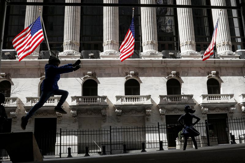 A child leaps off a bench outside the NYSE in
