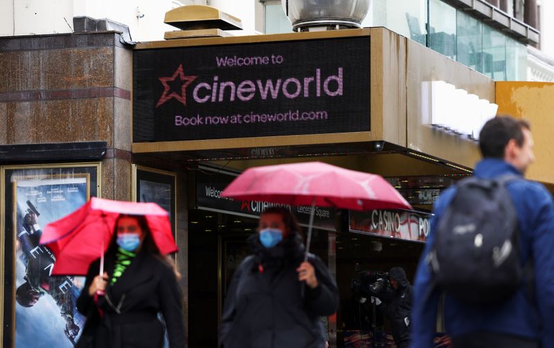 People walk past a Cineworld in Leicester’s Square in London