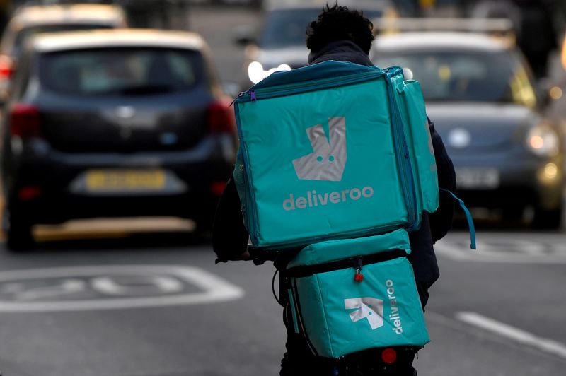 FILE PHOTO: Deliveroo delivery rider cycles in London, Britain