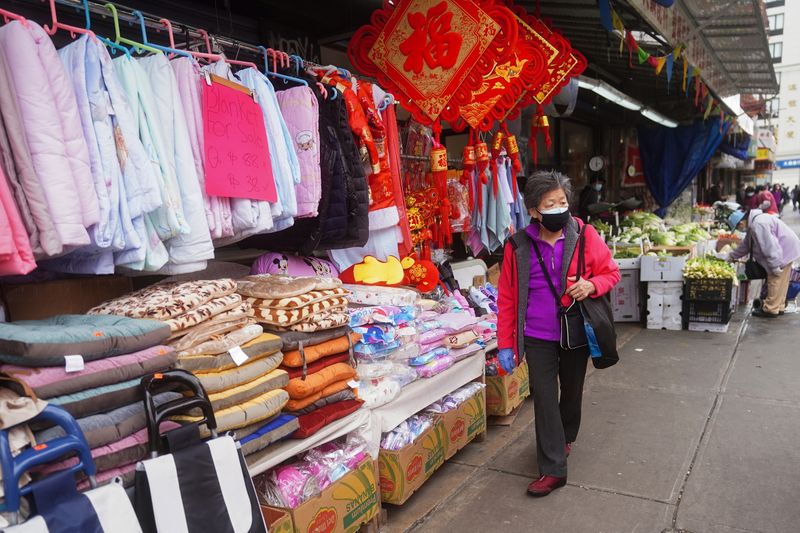 A woman shops in Chinatown in New York City