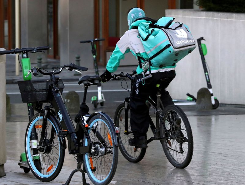 FILE PHOTO: A courier for food delivery service Deliveroo rides