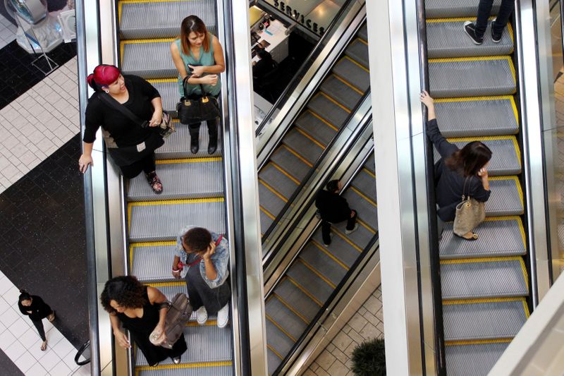 FILE PHOTO: Shoppers ride escalators at the Beverly Center mall