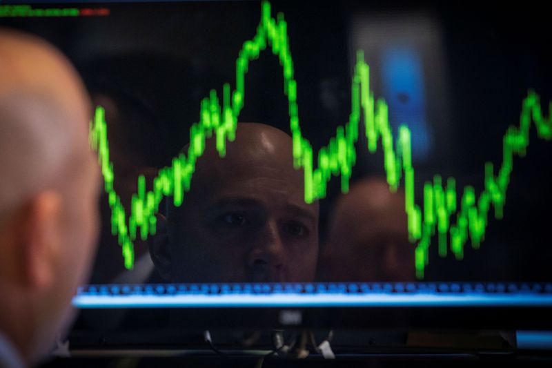 FILE PHOTO: FILE PHOTO: A Specialist trader watches his chart