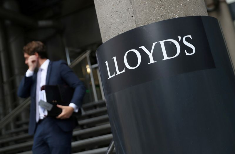 FILE PHOTO: A man walks out of Lloyd’s of London’s