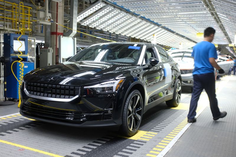 Workers are seen on a production line for Polestar, Volvo