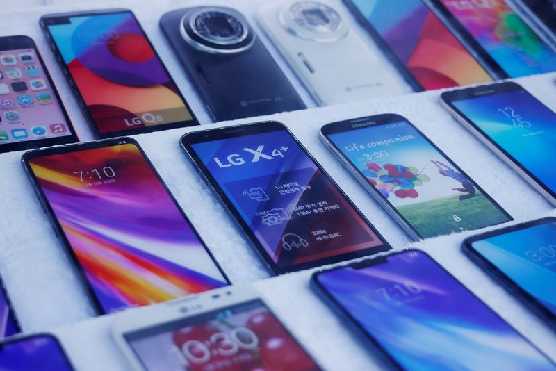 Mock old version LG Electronics’ smartphones are displayed at a