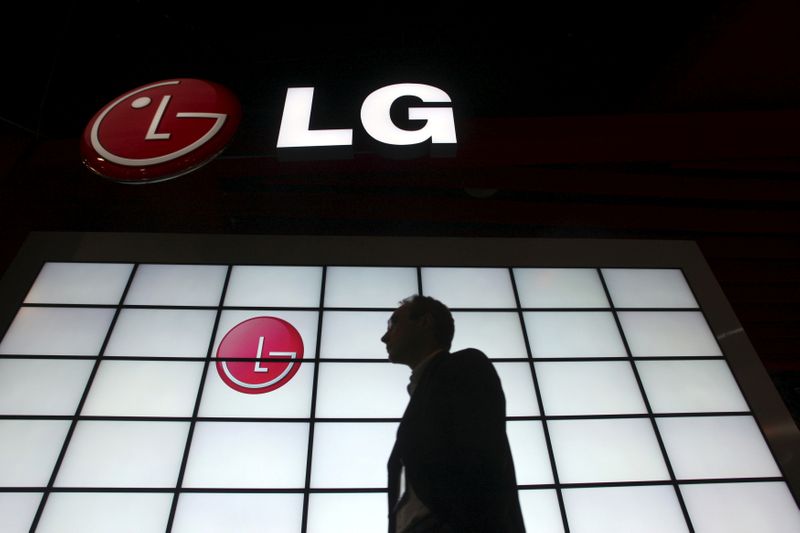 FILE PHOTO: A show attendee passing by the LG Electronics