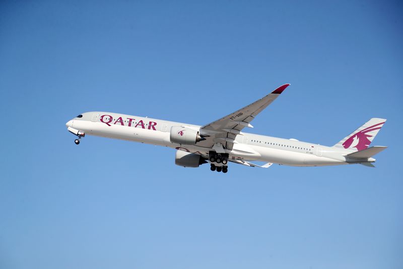 FILE PHOTO: A Qatar Airways plane takes off at Hamad