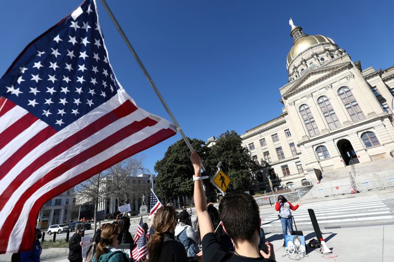 FILE PHOTO: Protesters rally against voting restrictions in U.S. state
