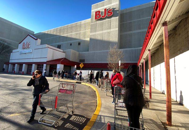 FILE PHOTO: A line of shoppers wait to enter BJ’s