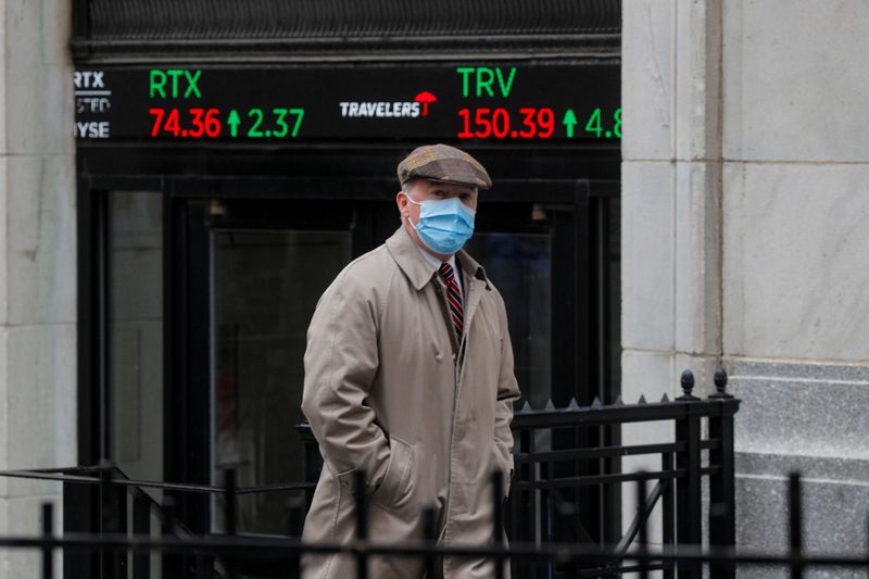 A trader exits the NYSE after the trading day in