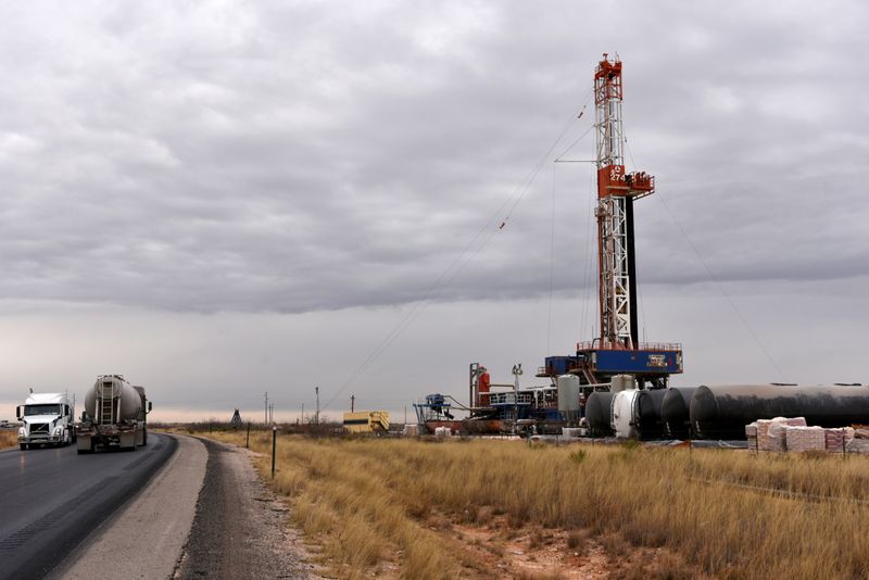 FILE PHOTO: A drilling rig operates in the Permian Basin