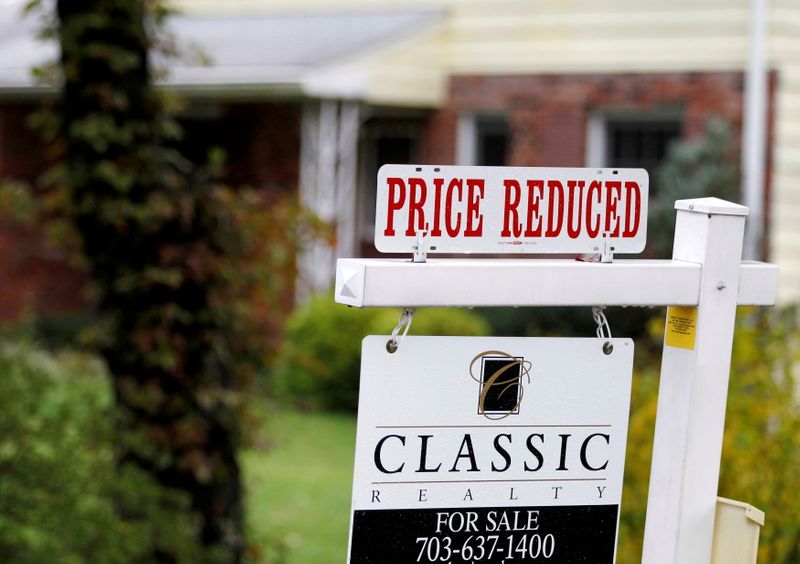 FILE PHOTO: A “Price Reduced” sign is displayed on a