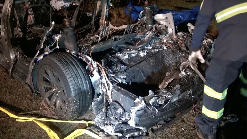 The remains of a Tesla vehicle are seen after it