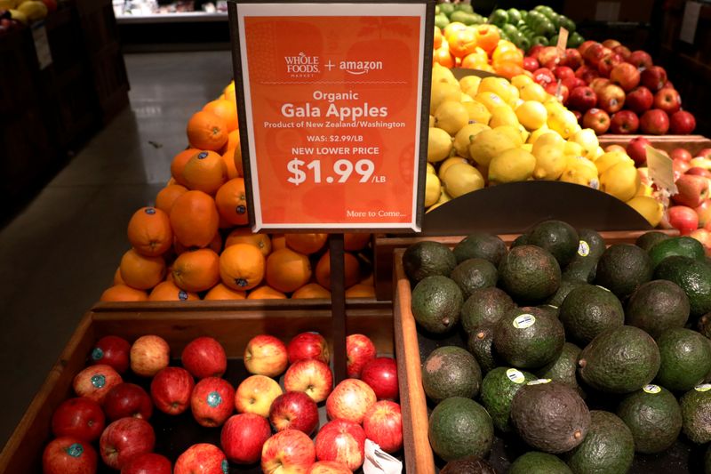Apples and Avocados are displayed at a Whole Foods store