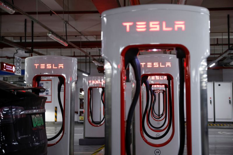 Tesla charging stations are pictured in a parking lot in