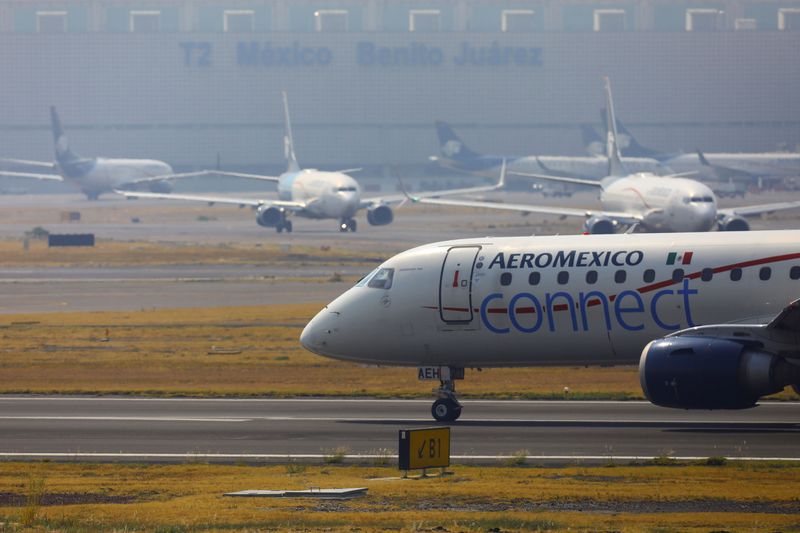 Aeromexico aeroplanes are pictured on the airstrip at Benito Juarez