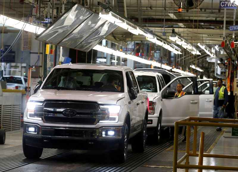 FILE PHOTO: Newly assembled Ford F150 pick-up trucks are driven