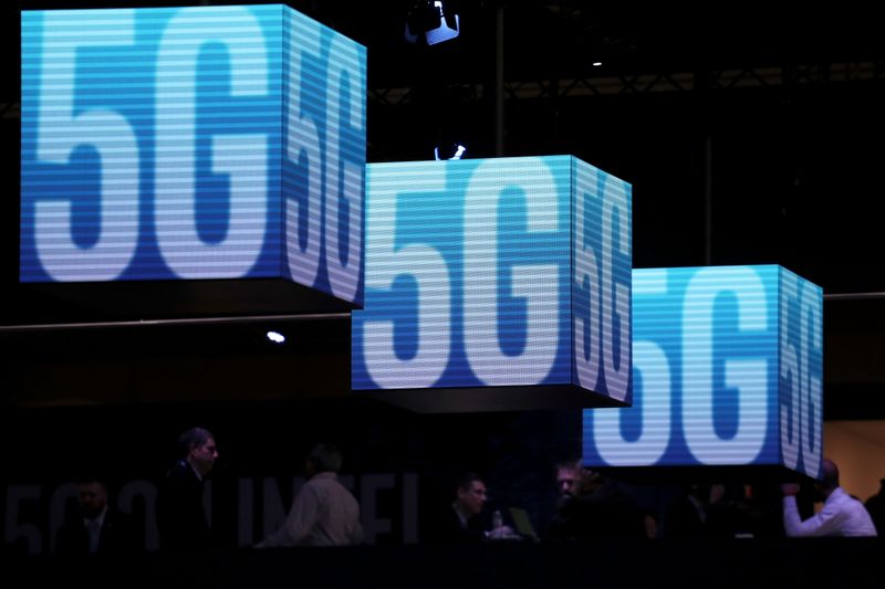 FILE PHOTO: Hanging cubes display 5G logo at the Mobile