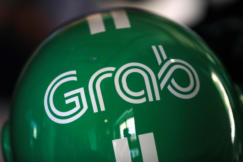 FILE PHOTO: A Grab motorbike helmet is displayed during Grab’s