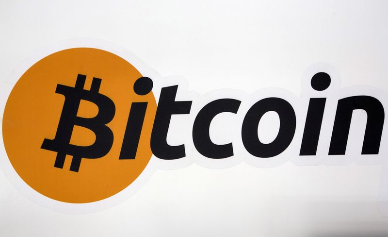 FILE PHOTO: A Bitcoin logo is displayed at the Bitcoin