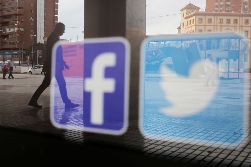 FILE PHOTO: Facebook and Twitter logos are seen on a