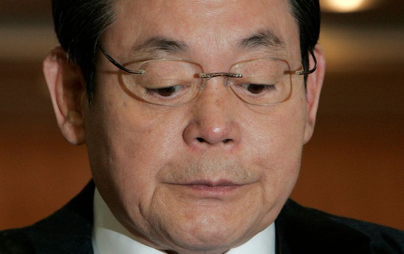 FILE PHOTO: Samsung Group Chairman Lee reacts during a news