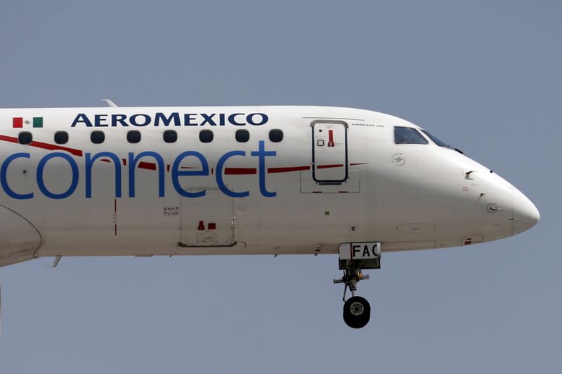 FILE PHOTO: An Aeromexico aeroplane flies before landing on the